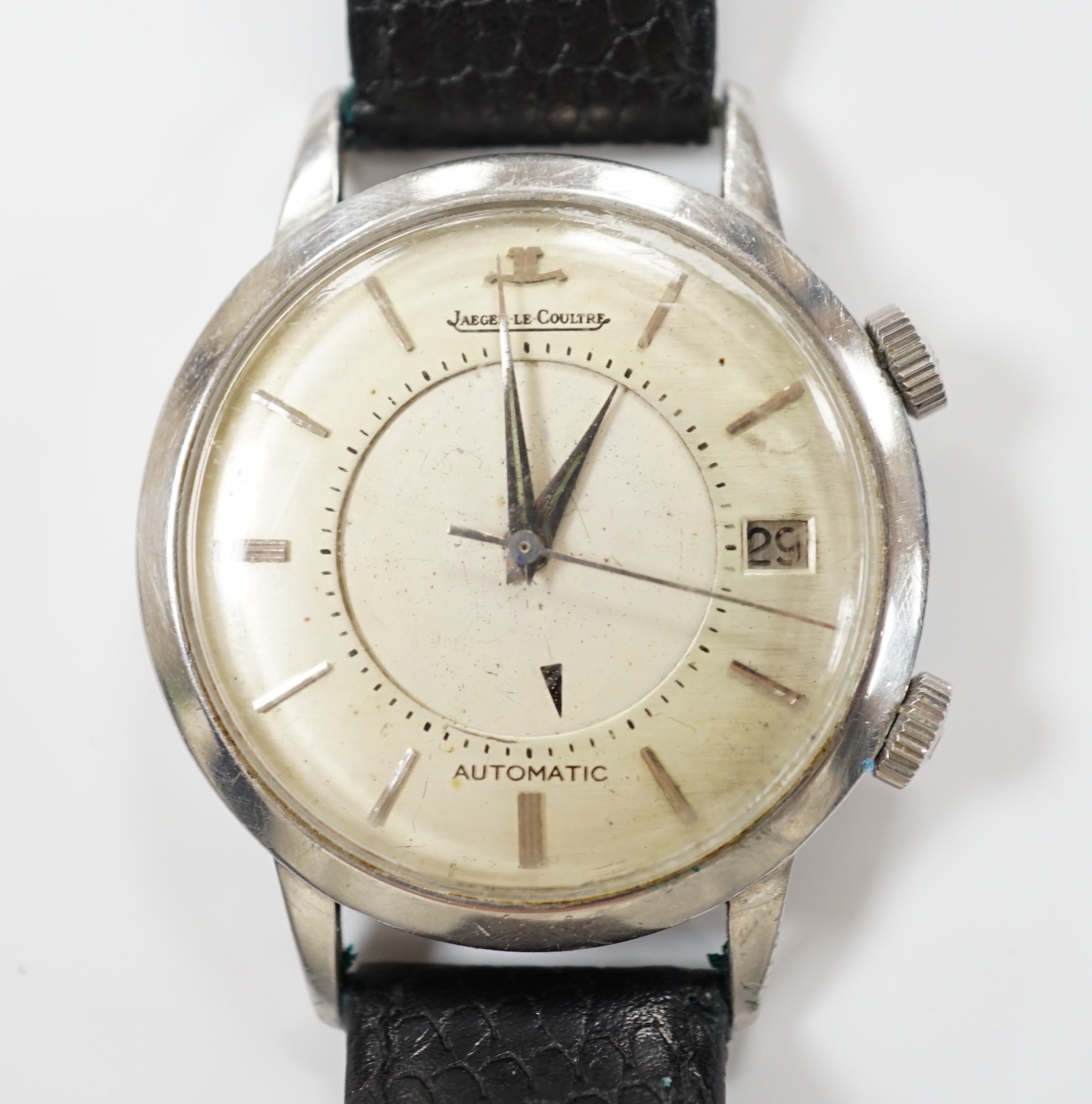 A gentleman's stainless steel Jaeger LeCoultre Memovox automatic 'oversize' wrist watch, with baton numerals and date aperture, case diameter 37mm, case back numbered 860368 on associated leather strap, no box or papers.